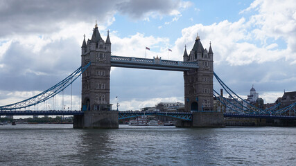 Fototapeta na wymiar Photo of tower bridge on a cloudy spring morning, London, United Kingdom