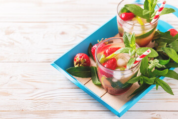 Cold lemonade with fresh strawberry, mint, lime and jam