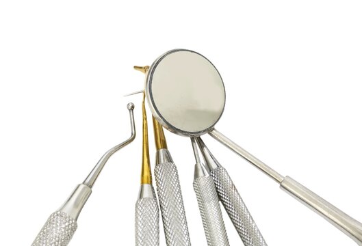 Many dental tools for cleaning the teeth and checking the caries