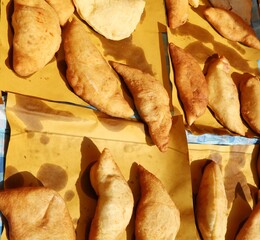 Big italian stuffed bread called Panzerotti  with tomato and che