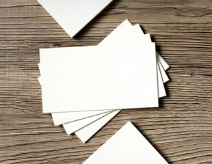 blank business cards on a wooden background