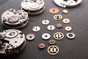 Detail of watch machinery on the table.