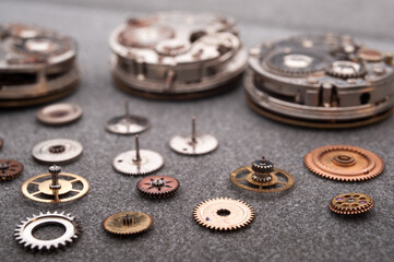 Detail of watch machinery on the table.