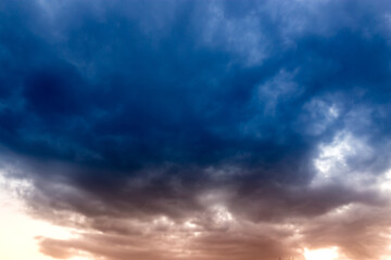 Naklejka na ściany i meble Beautiful clouds at sunset after rain as background .
