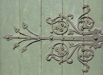 Ornament metal fittings on ancient medieval wood door