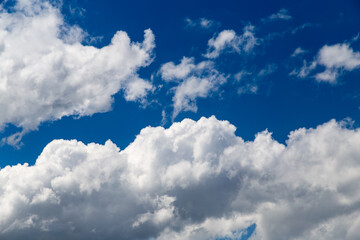 Naklejka na ściany i meble Beautiful clouds against blue sky as background
