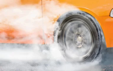 Fototapeten Drag racing car burns tire for the race (front wheel drive) © toa555