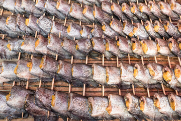 Dried fish on bamboo basket.