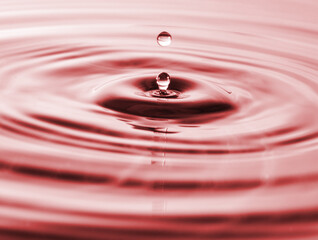 Splashes of water. Water drops. Photo of drop of a drop in water.