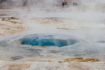 .Natural landscape of the blast process of a Geyser in Iceland.