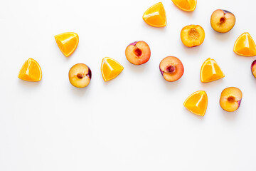 cut peach and orange for exotic fruit on white background top view mockup