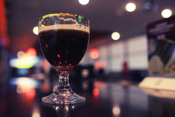 Serving a glass of red wine in a restaurant
