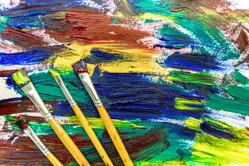 multicolored paint design with brushes for abstract texture background