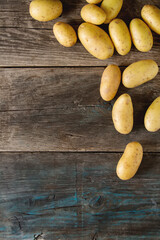 Body multicolored potatoes, Dark background. The farm market. Food for a vegan and a vegetarian. Diet, detox, food concept.