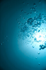Bubbles under clear azure water