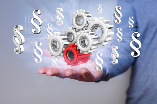 Industry Regulations, hand with gear wheels and paragraphs