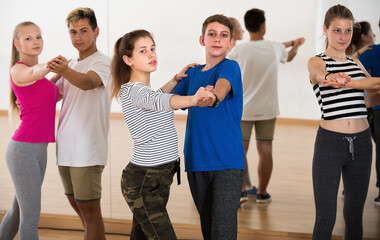 Teenagers studying together of partner dance