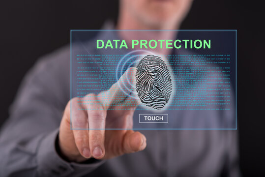 Man touching a data protection concept on a touch screen