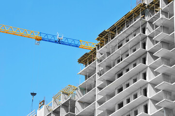 Crane and highrise construction site