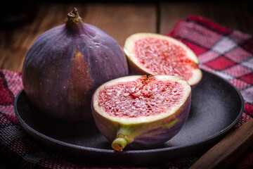Sliced figs on a wooden table. Top view.