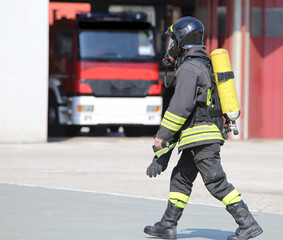 Firefighter with large oxygen cylinder and automatic respirator