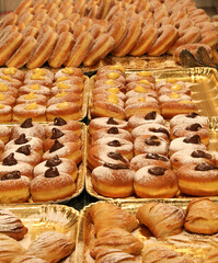 many donuts and creamy velvet for sale in the pastry shop