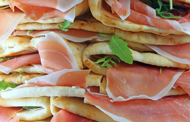 sandwiches called Spianata or Piadina in Italian with raw ham an