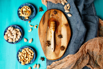 Nuts and honey on a rustic table