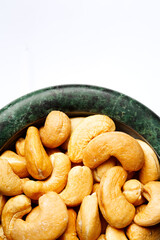 Roasted cashew nuts in a marble bowl