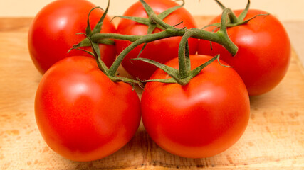 top view of red tomatoes on wooden table