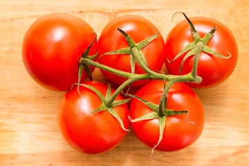 top view of red tomatoes on wooden table