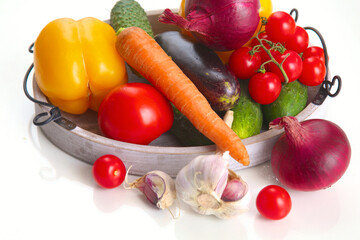 Fresh autumn vegetables on a white background