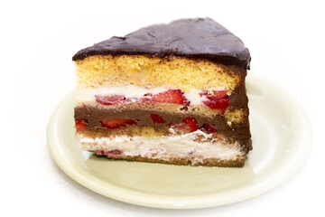 A slice of birthday cake made in the house with organic ingredients