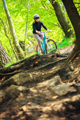 Young Woman Riding Her Mountain Bike