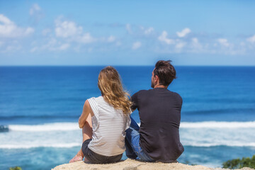 Couple enjoying the view on a tropical beach.