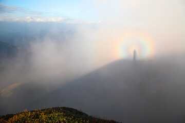 Optical illusion Brocken Spectre  in the meadow.