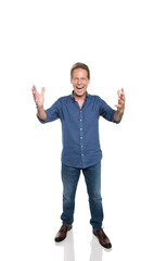 Fototapeta premium Excited middle aged man with open hands and looking at camera isolated on white