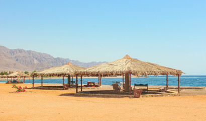 Cottage in a Camp in Sinai, Taba desert with the Background of the Sea and Mountains.