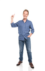 smiling middle aged man pointing up and posing isolated on white