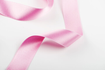 Pink ribbon on white background. Isolated.