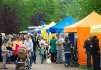 Blurred image of people on food market.