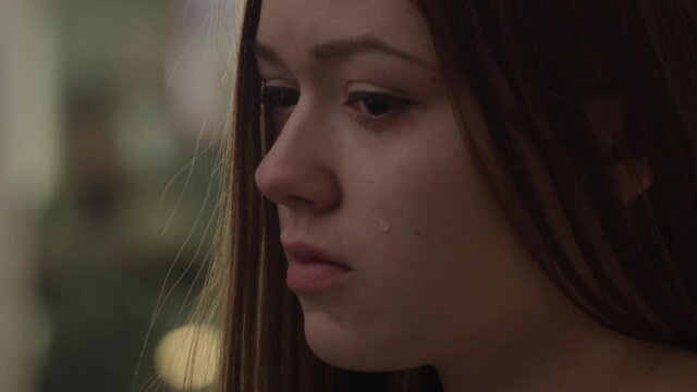 beautiful, sad girl crying alone.Macro.