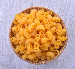 Macaroni in basket topview on table