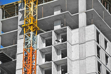 Crane and highrise construction site