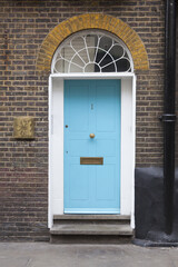 Naklejka premium turquoise front door of number one somewhere in london