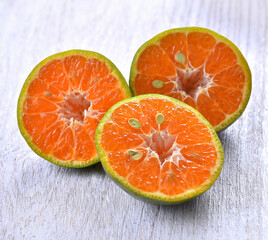  Tangerine half cut on table wooden