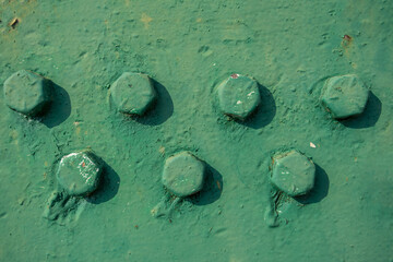 Metal beams with screws with paint color 