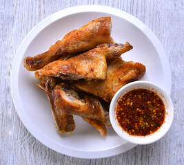 Grilled chicken in white dish top view