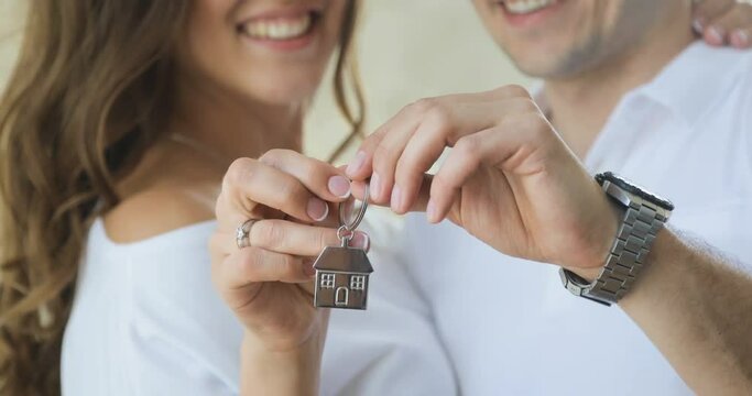 Married couple get a key to their new home.