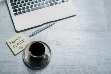 office working desk, top view with laptop, notepad and coffee with memo notes or sticky sticker